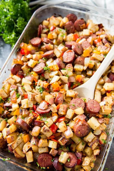 Baked Sausage, Potatoes, and Peppers: A hearty and filling side dish, full meal, breakfast hash, with plenty of flavor. This Potato, Pepper, and Sausage Bake is perfect for grilling season too! Baked Sausage, Potato Sausage, Sausage And Potatoes, Brunch Bake, Sausage Dishes, Sausage Bake, Jambalaya, Sheet Pan Recipes, Full Meal Recipes