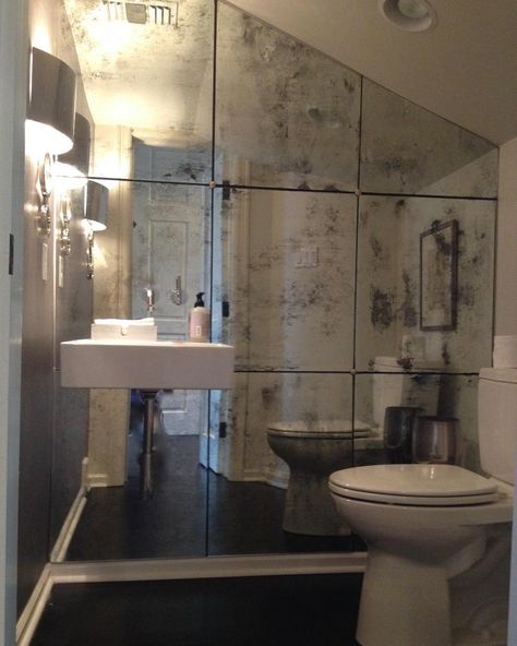 Full Mirror Bathroom Wall, Mirrored Powder Room Wall, Mirrored Powder Room, Smokey Mirror Wall, Full Mirror Wall Bathroom, Bathtub Mirror Wall, Mirror Tile Shower Wall, Space Between Mirrors In Bathroom, Bathroom Mirrored Wall