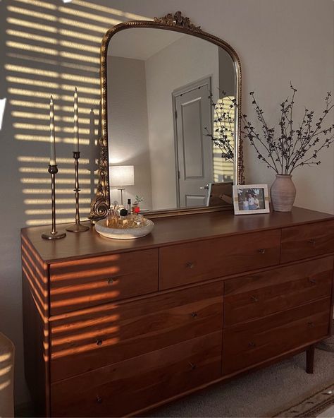 Wood Dresser Bedroom Ideas, Minimal Dresser Styling, Oval Mirror Over Dresser, Bedroom Commode Ideas, Midcentury Dresser Styling, Vintage Wood Dresser Bedroom, Desk And Dresser In Bedroom, Big Mirror On Dresser, Brown Wood Dresser Bedroom