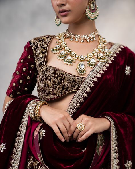 Step into the elegance of a bygone era with our Exquisite Mayuri Maroon Lehenga — a true masterpiece of timeless charm. Crafted from luxurious silk velvet, this exquisite ensemble features hand-embroidered Zardosi and intricate Dabka work, beautifully highlighting regal peacock motifs. The matching blouse and odhni-style dupatta with delicate Zardosi detailing complete this look of pure sophistication and grandeur. Perfect for weddings, celebrations, or any special occasion, the Mayuri Lehen... Zardosi Lehenga, Maroon Lehenga, Wedding Seasons, Dabka Work, Peacock Motifs, Velvet Lehenga, Maroon Wedding, Wedding Blouse, Bygone Era