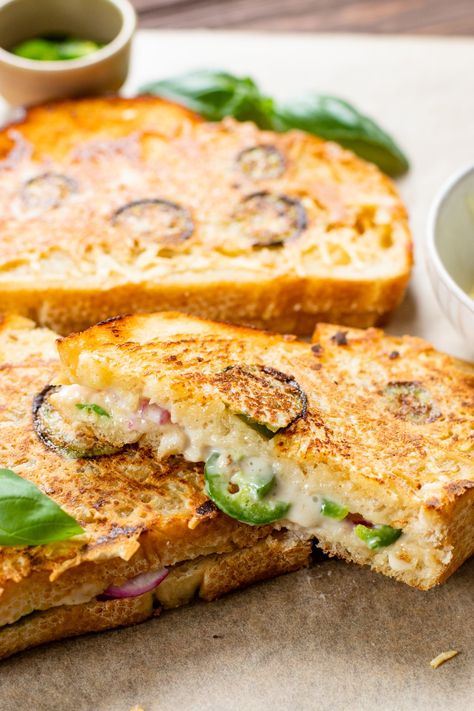 This Vegan Jalapeño Popper Grilled Cheese is the ultimate comfort food. Coated in vegan parmesan and filled with spicy jalapeños & red onion | ThisSavoryVegan.com #thissavoryvegan #vegangrilledcheese #vegansandwich Vegan Grilled Cheese Sandwich, Easy Vegetarian Sandwiches, Vegan Wraps Lunch, Vegan Bbq Food, Vegetarian Comfort Food Recipes, Savory Vegan Breakfast, Vegan Picnic Food, Rainbow Rangoli, Popper Grilled Cheese