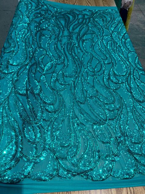 Lorelei TEAL Swirls Sequins on Mesh Lace Fabric by the Yard - 10133Content: 100% polyesterStretch: 4-wayWidth: 56 to 59 inchesEdge: StraightUses: Wedding/evening gowns, formal wear, dresses, tops, skirts, decorations, costumes, apparel accents/appliqué, crafts, etc.*********************************************************************************************DISCLAIMER: Expedited shipping options do not apply to 5, 10, 50 and 100 yard options.Sample/Swatch: 4x2 inches for $4.99 each, free shipping Wedding Veils Lace, Drops Patterns, Formal Wear Dresses, Pretty Fabric, Discount Fabric, Stretch Velvet, Evening Gowns Formal, Drops Design, Cut And Color