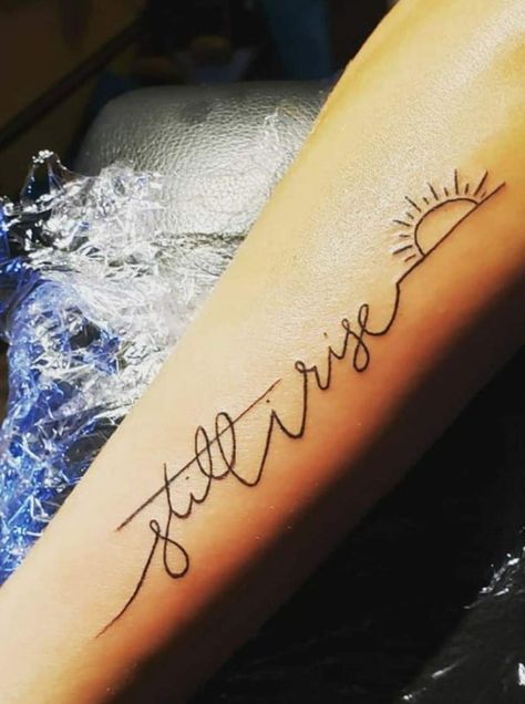 60+ Inspiring Still I Rise Tattoos with Ideas and Meanings 47 She Will Rise Tattoo, Strength Wrist Tattoos For Women, Overcome Tattoos, Calm Tattoo Ideas, Divorce Tattoos For Women, Rise Tattoo Ideas, Still I Rise Tattoo Ideas, I Rise Tattoo, Still I Rise Tattoo