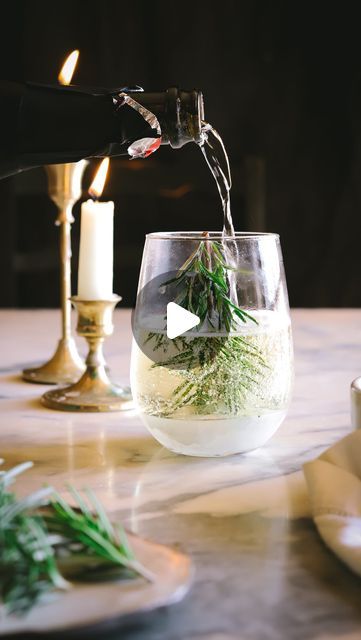 Marina Delio on Instagram: "Snow Globe Drink 🌲 
I’m not sure who came up with the viral snow globe cocktail idea - if you know, please tag them below. Here are my tips for making them: 
❄️ 
Snow Globe Cocktail Recipe

Ingredients:

·	room temperature water
·	Fresh rosemary sprig (about as tall as the glass)
·	twine or yarn and tape (if needed)
·	Pomegranate seeds 
·	Clear sparkling beverage (Champagne, sparkling water, kombucha, etc.)

Instructions:

1.	Fill a freezer-safe stemless wine, champagne or other glass with 1 inch of room temperature water.
2.	Place a rosemary sprig, upside down down in the water. This works best if you snip the top off the rosemary so it has a flat base on which to stand. If it won’t stay upright, wrap a piece of twine around the top of the “tree” across the to Wedding Buffet Table, Party Buffet Table, Thanksgiving Appetizer Recipes, Holiday Dinner Party, Wedding Buffet, Rosemary Sprigs, Dinner Party Recipes, Festive Drinks, Thanksgiving Appetizers