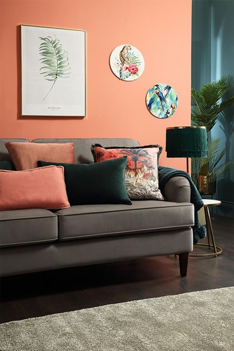 Pink Orange Grey Living Rooms, Coral Lounge Living Rooms, Peach Living Room Walls Colour Palettes, Bright Colour Lounge Ideas, Sage And Coral Living Room, Peach Accent Wall Living Room, Peach Living Room Decor Ideas, Grey And Coral Living Room, Peach And Brown Living Room