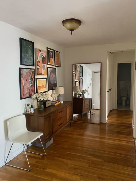 Hallway with frames hanging above buffet and floor-length mirror at the end Floor Length Mirror Bedroom, Brooklyn Apartment Decor, Provincial Bedroom, French Provincial Bedroom, French Provincial Decor, Floor Length Mirror, Modern Vintage Furniture, Rental Apartment, Side Board