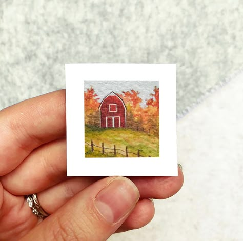 This print features a tiny Autumn scene(You can see the process behind them on Instagram @micks.art.goods). These prints are the same tiny size as the original paintings. Check out all mini seasonal designs from the series here: https://www.etsy.com/listing/1302219326/printed-mini-1-halloween-autumn-fall This artwork also has the option of being framed in their own tiny frames. There are four options for frames-- classic or black wall frames, dangling frames, or magnet frames. All frames have be Fall Watercolor Paintings Easy, Fall Watercolor Paintings, Tiny Watercolor Paintings, Mini Watercolor Paintings, Fall Orchard, Tiny Artwork, Tiny Frames, Tiny Pics, Autumn Farm