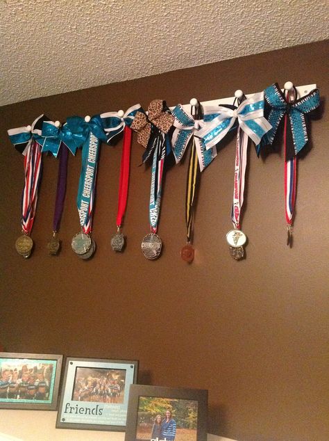 Peg Strips from Lowe's great way to display medal's and bows! Cheer Medal Display, Cheerleading Medal Display Ideas, Cheer Bow Display Ideas, Cheer Metal Display Ideas, Cheer Medal Display Ideas, Cheer Bedroom, Cheer Room, Cheerleading Crafts, Cheer Bow Holder