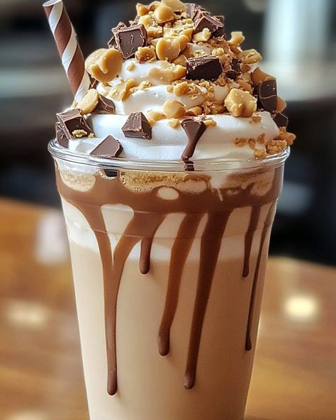 Peanut Butter Cup Frappuccino 🥜 Ingredients - 1 cup brewed coffee, cooled - 1 cup milk of choice - 3 tablespoons peanut butter - 2 tablespoons chocolate syrup - 2 cups ice - Whipped cream for topping - Additional chocolate syrup for drizzling Instructions 1. In a blender, combine cooled coffee, milk, peanut butter, chocolate syrup, and ice. 2. Blend until smooth and creamy. 3. Pour the frappuccino into a tall glass. 4. Top with whipped cream and drizzle with chocolate syrup. 5. Serve imme... Peanut Butter Chocolate Milkshake, Milkshake Peanut Butter, Milkshake Recipe Peanut Butter, Oreo Coffee Milkshake, Caramel Milkshake Aesthetic, Peanut Snack, Cool Coffee, Refreshing Drinks Recipes, Brewed Coffee