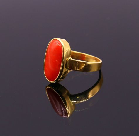 Traditional style handmade 22karat yellow gold gorgeous red coral stone handmade tribal ring band jewelry from rajasthan india. weight- 7.50 grams approx. metal-yellow gold. metal purity- 22carat. brand-handmade. marking- 916 stamp. stone-coral. size-custom size(tell us inner diameter in mm) weight of ring may be increase or decrease according to size. note-gold jewelry is handmade designer jewelry . so there can be slight difference in size and weight of the article in the comparison of the des Pagadam Rings, Pagadam Rings For Women, Coral Stone Ring, Red Coral Stone, Stone Ring Design, Engagement Rings Couple, Gold Earrings Models, Ruby Ring Gold, Single Stone Ring