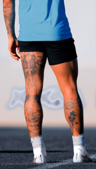 Explore 15+ thigh tattoos for men. Find inspiration for thigh tattoos, from small designs to unique ideas for guys. Elevate your style with attractive tattoos on the thighs. Mens Tattoo Leg Sleeve, Tattoo On Legs For Men Ideas, Back Of Calf Tattoo Men, Soccer Tattoos For Men Leg, Back Of Leg Tattoos Men, Leg Tattoos For Men Calves, Back Leg Tattoo Men, Men’s Thigh Tattoo Ideas, Athlete Tattoos Men