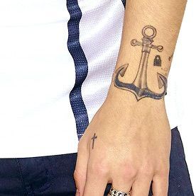 Harry Styles’ 52 Tattoos & Their Meanings | Body Art Guru Harry Styles Hand Tattoo, Harry Guitar Tattoo, Harry Styles Tatooes, Harry’s Tattoos, Harry Styles Anchor Tattoo, Tatoos Harry Styles Inspired, Tatuajes Harry Styles, Hs Tattoo, Larry Tattoos