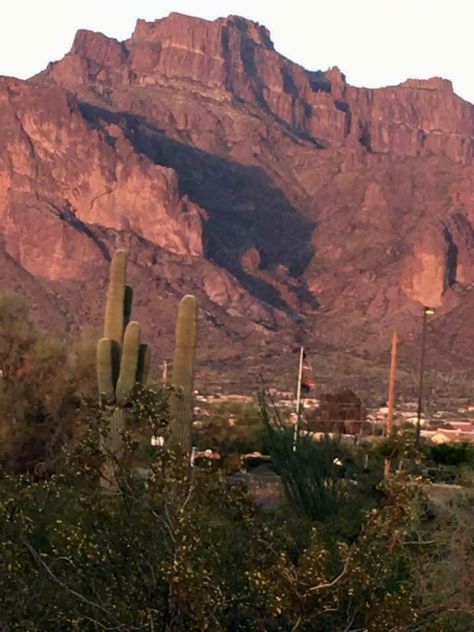 SHADOW OF A COUGAR ATTACKING ITS PREY ON SUPERSTITION MOUNTAIN OCCURS ONLY TWICE A YEAR FOR 6 DAYS. 3 IN MAR. & 3 IN SEPT. APACHE JUNCTION. ARIZ.