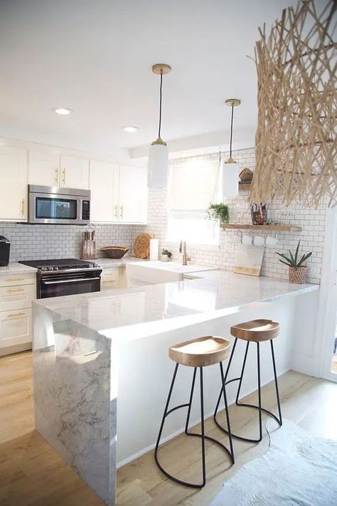 a refined U shaped kitchen with white cabinetry, white stone countertops, wooden stools, open shelves and pendant lamps Kitchen Design Small Space, Cabinet Remodel, Kitchen Cabinet Remodel, White Kitchen Design, Small Space Kitchen, 아파트 인테리어, Kitchen Plans, White Kitchen Cabinets, White Cabinets