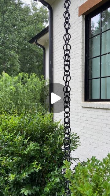 Kelly Jones on Instagram: "We’ve been putting some finishing touches on the flip house. One was installing a rain chain on the front porch just like the one we have on ours. Link in bio for full tutorial." Rain Chain Into Rain Barrel, Diy Rain Chain Dollar Stores, Chain Gutter Downspout, Chain Rain Gutters, Rain Catcher Chain, Tiny Front Porch Decor, Rain Chains Gutter Downspout Ideas, Rain Chain Basin Ideas, Rainchain Ideas