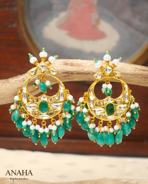 These chandbalis feature an oval emerald inset with exquisite floral relief work in kundan. Adorned with phungars—raised gold caps encasing pearls—they are finished with delicate bunches of pearls and emeralds. • • • • • • • • • #anahakundanjewelry #simrangosal #luxuryjewelry #bridesofindia #chandigarhjewellery #heritagejewelry #chandbalis #chandbaliearrings #earrings #hallmarkedjewellery #gemstonejewelry #indianjewellery Kundan Jewelry, Heritage Jewellery, Chandbali Earrings, Gold Caps, Kundan Jewellery, Indian Jewellery, Luxury Jewelry, Gemstone Jewelry, Emerald