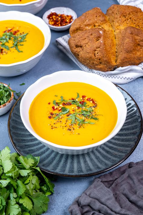 A delicious combination of carrots, parsnips, ginger and just a touch of chilli, this Easy Carrot and Parsnip Soup is warming, budget friendly, nutritious and very simple to make. #soup #carrotsoup #parsnipsoup #carrot #parsnip #ginger #chilli #easysoup #cheapfood #budgetfood #makeahead #onepot #under500calories #vegan #vegetarian #easyentertaining #easymidweekmeals #easymeals #midweekmeals #easyrecipes #easydinners #dinnertonight #dinnertonite #familydinners #familyfood #easypeasyfoodie Carrot And Parsnip Soup, Carrot Parsnip, Traditional Irish Soda Bread, Parsnip Soup, Homemade Soda, Midweek Meals, Carrot Soup, Christmas Food Dinner, Soda Bread