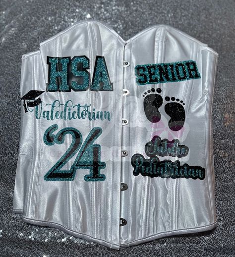 CUSTOM #seniorcorset ! 🎓 done by @jaicreativecollection 🎀 —————————— DM or TEXT (313)318-0114 to place an order📲 ✨ —————————— Available in all colors, schools & sizes! ANY Customization is available 🔥 —————————— #senior2024 #futurernbsn #seniorszn #classof2024 #jaicreativecollection🎀 #casstech #seniorsets #detroitsmallbusiness #ct #customsenioroutfit Cass Tech, Portrait Outfits, Custom Corset, Senior Portrait Outfits, Custom Corsets, Ultrasound Tech, Cap Decoration, Placing An Order, Graduation Cap Decoration