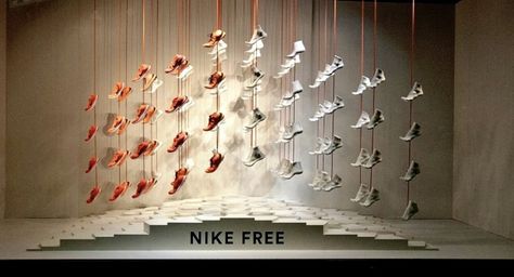 This is a one item display from Nike, it lines up a running shoe in a chevron pattern over a slogan. The arrangement is monochromatic orange, with a lighter tint the further right you go until it becomes white. Spring Paris, Shoe Store Design, Sneaker Displays, Display Retail, Retail Windows, Elements And Principles, Retail Merchandising, Retail Store Design, Retail Design Blog