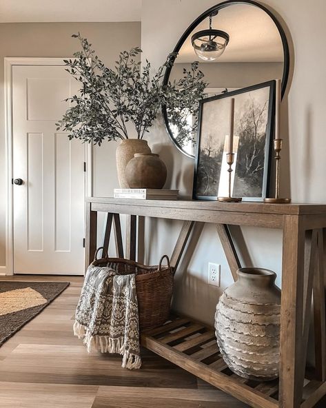 24+ Creative Fall Entryway Decor Inspirations (& Tips) - DrExplains Foyer Table With Round Mirror, Jungle Entryway, Entryway Lamps Foyer Tables, Mirror Hallway Entrance, Entryway Ideas Shoes, Cozy Entryway Ideas, Round Mirror Entryway, Entrance Way Ideas, Round Mirror Decor Ideas