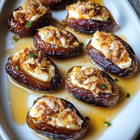 Mascarpone-Stuffed Dates with Maple Drizzle are the perfect balance of sweet, creamy, and luxurious flavors packed into an irresistible bite-sized treat. With their chewy, naturally sweet flavor, dates make an ... Read more Marscapone Stuffed Dates, Stuffed Date Appetizer Recipes, Stuffed Dates Dessert, Dates Appetizer Recipes, Baked Dates, Recipes With Dates, Dates Dessert, Dates Recipes, Stuffed Dates