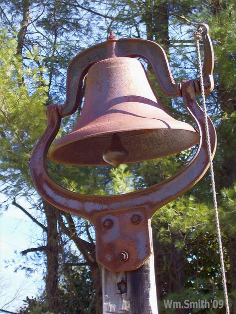 school bells | School Bell | Old school bell mounted high on a post so the ... Dinner Bell Post, Old Fashioned School, School House Bell, Bell Pictures, Antique Bell, Burlap Door Hanger, Farm School, Rustic Log Cabin, Bell Sound