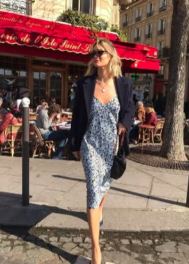 Slip dress outfit on a French girl. Here are 9 French girl style tips to steal! Tons of outfit ideas and outfit inspo in this blog post. #parisianchic #parisianstyle #frenchstyle #frenchoutfits #adenorah