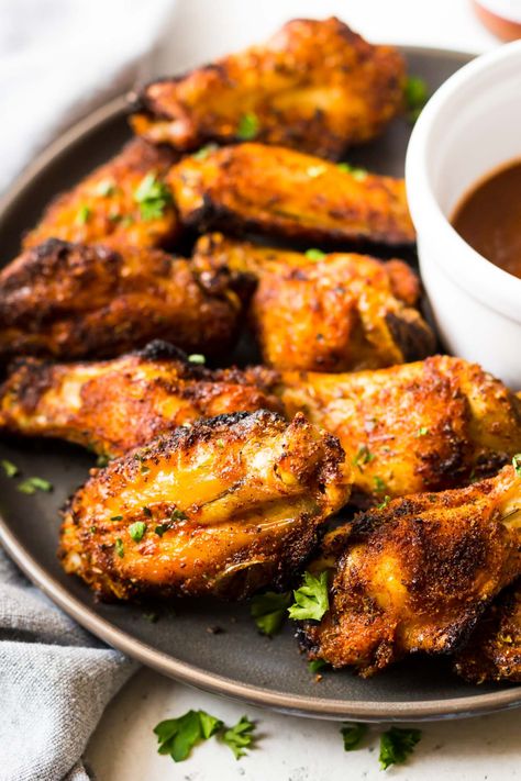 These are the best crispy air fryer chicken wings! They are seasoned with a perfect dry rub and then crisped in the air fryer in just 30 minutes. The whole family will love this easy and healthy recipe. Whole30, Paleo, and gluten free too! #crispychickenwings #airfryerrecipe #airfryerchickenwings Tandoori Chicken Wings, Chicken Rub Recipes, Dry Rub Chicken Wings, Air Fryer Wings, Frozen Chicken Wings, Chicken Crispy, Dry Rub Recipes, Crispy Chicken Wings, Chicken Wings Recipe