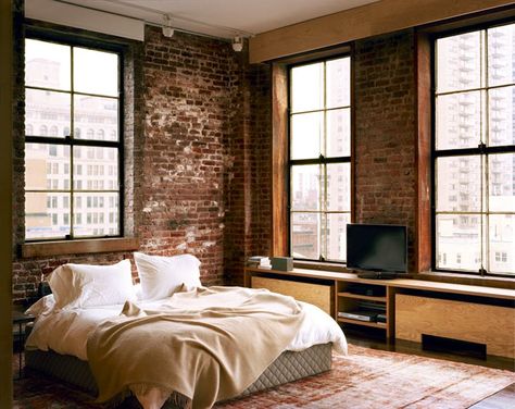 Picture Of a stylish bedroom with brick walls, plywood furniture and boho rugs plus an upholstered bed Apartment Rooms, Plywood Bed, Brick Wall Bedroom, Brick Bedroom, Bedrooms Interior, Modern Balcony, Boho Rugs, Rattan Outdoor Furniture, Home Design Diy