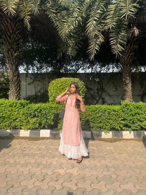 A girl wearing pink chicken kurti with white sharara, standing in the sun and posing candid. Pink Chicken Kurti, White Plazo, White Sharara, Kurti With Jeans, Chicken Kari, Pink Kurti, White Chicken, Boutique Dress Designs, Boutique Dress