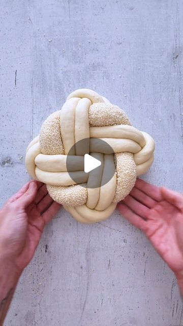 Idan Chabasov AKA Challah Prince™ official on Instagram: "Get ready for Rosh Hashanah with a Round Challah! I'm thrilled to share my first round challah tutorial for the upcoming High Holidays! This challah is perfect for your Rosh Hashanah table, symbolizing the endless cycle of life and new beginnings. Watch the full video to see the braiding process, and save your spot—Rosh Hashanah is just around the corner!  🍞Recipe for this beautiful round challah: 330g water 10g dry yeast 75g sugar 15g salt 75g olive oil 750g flour  ⚖️Dough Division Instructions: Divide the dough into 9 strands in total: 8 strands for the main braid and 1 strand coated with sesame for decoration.  8 strands, each weighing 120g, should be rolled to a length of 20 inches or 50 cm. The sesame-coated strand should weig Round Challah For Rosh Hashana, Challah Braiding Tutorials, Rosh Hashana Challah, Round Challah Braiding, Rosh Hashanah Table Decorations, Rosh Hashana Decorations, Braiding Tips, Challah Rolls, Round Challah