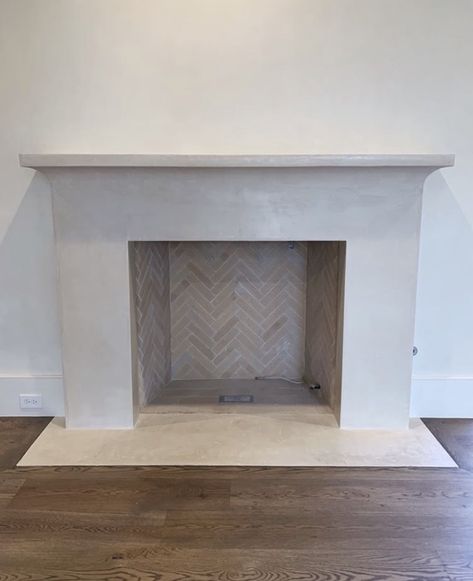 Precast Stone Fireplace, Herringbone Stone Fireplace, Limestone Surround Fireplace, Indoor Fireplace Tile Ideas, Herringbone Tiles Fireplace, Herringbone Tiled Fireplace, Concrete Mantle Fireplace, Plaster And Tile Fireplace, Cast Concrete Fireplace Surround