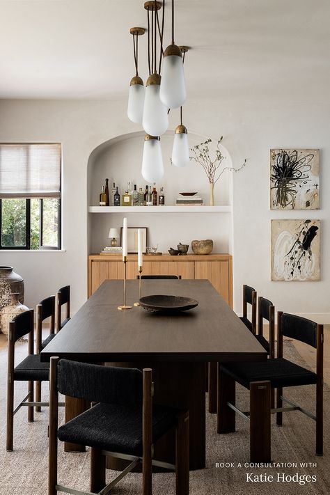 This dining room designed by Katie Hodges features an Apparatus Studio chandelier, a home bar recessed into an arched nook, and a modern dark wood dining table. Like what you see? Book a 1:1 video consultation with Katie Hodges on The Expert and get personalized interior design advice for your space. Dining Room Built In, Dark Wood Dining Table, Luxe Magazine, Dark Dining Room, Dark Wood Table, Chic Dining Room, Golden Rules, Wood Dining Room, Furniture Office