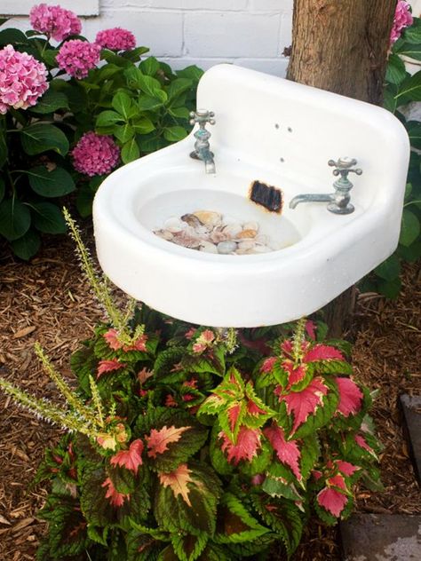 Create a unique birdbath out of a vintage, wall-mount sink. This fun DIY project will add charm to your yard, and create a fun hangout for your feathered friends. Get the step-by-steps on HGTV.com. Jardin Style Shabby Chic, Taman Vintage, Bird Bath Ideas, Diy Snowman Decorations, Bath Garden, Old Sink, Shabby Chic Decorating, Diy Bird Bath, Shabby Chic Garden