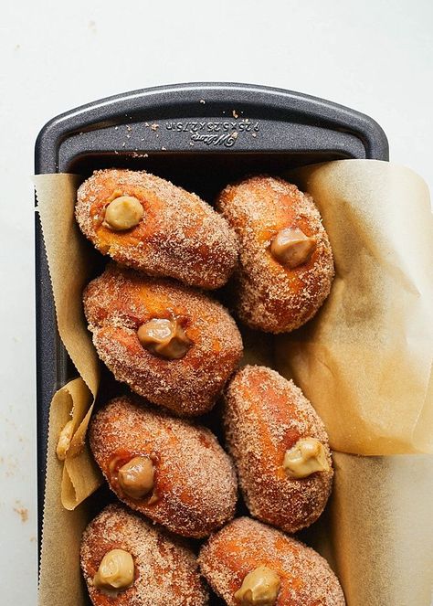 Coffee Donuts by Wood and Spoon blog. This is a recipe for cinnamon sugar doughnuts filled two ways- with a coffee / espresso custard or a coffee cream. For a sweeter taste, try the cream with a buttercream/ white cream filling. For a creamy mouthfeel and rich eclair filling, try the cooked custard make with eggs, milk, and butter. These fried doughnuts are delicious breakfast or brunch option! Find the recipe by Kate Wood on thewoodandspoon.com Cinnamon Sugar Recipes, Coffee Treats, Coffee And Donuts, Breakfast Toast, Doughnut Recipe, Coffee Cream, Donut Recipes, Sweet Taste, Cinnamon Sugar