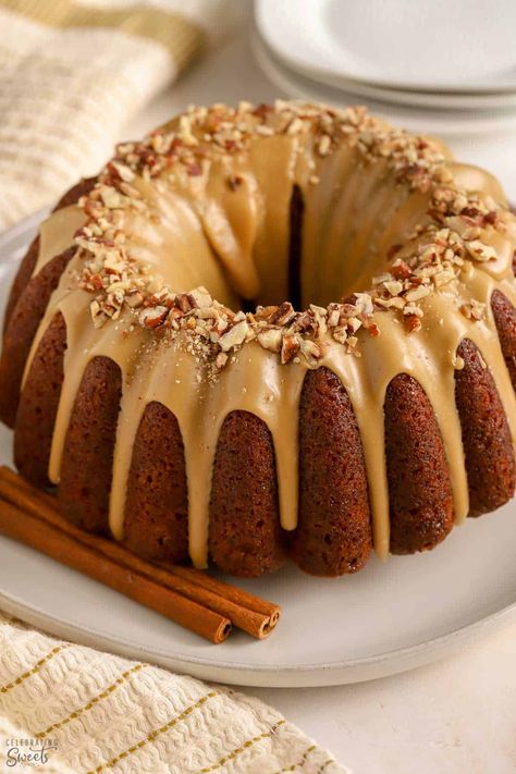 Bundt shaped spice cake covered in a maple glaze and topped with pecans. Cake With Caramel Icing, Amaretto Cheesecake, Sweet Potato Pound Cake, Bakers Delight, Buttermilk Pound Cake, Guinness Chocolate, Nutella Fudge, Apple Bundt Cake, Cake With Caramel