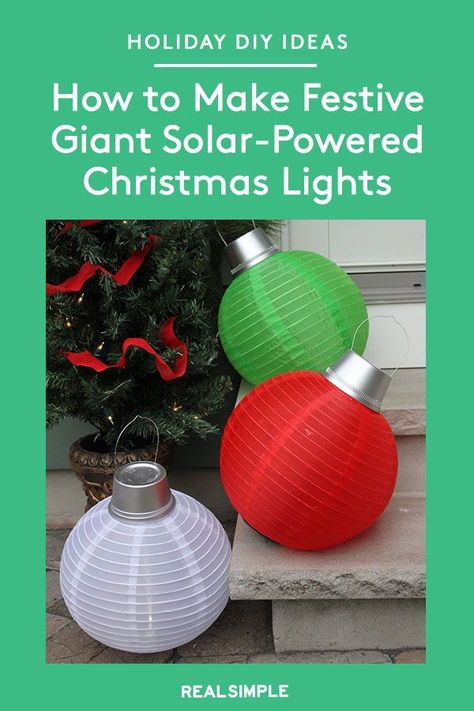 How to Make Giant Solar-Powered Christmas Lights | If you're looking for an easy holiday decorating idea that makes a big statement, look no further than these glowing, oversized Christmas ornaments. Place these decorations on your front stoop, lawn, or porch—these weatherproof orbs will shine outdoors or inside. #holidaycrafts #realsimple #diydecor #holidaydiydecor #holidayinspiration #details #frontdoorwreath Ornament Lights Outdoor, Large Christmas Balls Outside, Diy Big Christmas Balls, Diy Christmas Pathway Lights, Front Yard Christmas Decorations Ideas, Oversized Christmas Ornaments, Solar Powered Christmas Lights, Fair Decorations, Light Balls Christmas