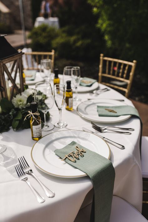 Mint, Sage & Blush with Gold Accents. These tables settings have gold-rimmed plates and gold laser cut names for each guest! The table numbers are standing gold numbers and line up against the green eucalyptus garland. Check out the blog to see more! Ashley Carlascio Photography | Auburn Wedding Photographer | California Weddings Green Table Party Decorations, Green Decor Wedding Receptions, Names For Wedding Tables, Wedding Guest Tables Set Up, Wedding Plate Decor, Wedding Plates Decoration, Sage Table Setting, Wedding Table Plate Set Up, Sage Table Setting Wedding