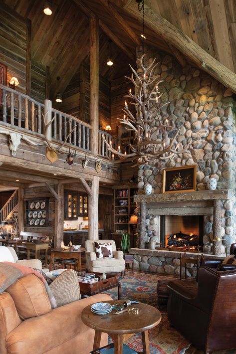 Inside this rustic lake home by Nor-Son Custom Builders, a striking two-story great room anchors the home and acts as the prime spot for family and friends to visit.  Visit the link to see more from this classic cozy cabin.  📸: Scott Amundson Large Cabin, Lodge Great Room, Old Cabin, Family Cabin, Building Remodeling, Lakeside Living, Rustic Lodge, Lake Cabins, Modern Cabin