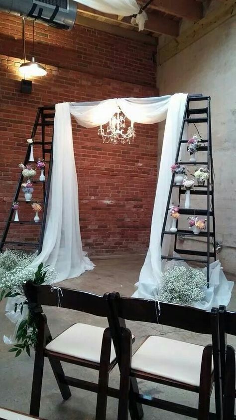 Simple. 2 wooden ladders stained dark with crossbar. Hang chandelier from crossbar. Drape chiffon around it. Wooden Crates Wedding, Blair Wedding, Candle Backdrop, Wedding Isle Runner, Ladder Wedding, Rainbow Wedding Theme, Decor Photobooth, Wooden Ladders, Baptism Decor