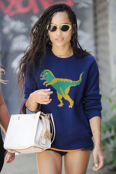 Gucci T-shirt vs Dinosaur jumper from Coach: Which is your favourite? | Glamour UK Coach Dinosaur, Zoe Kravitz Style, Spring Trousers, Zoe Isabella Kravitz, Dinosaur Sweater, Zoë Kravitz, Gucci T Shirt, Zoe Kravitz, Celebrity Street Style