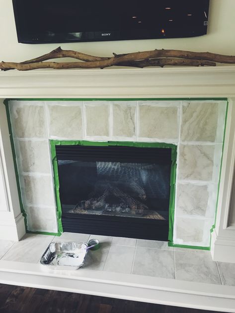 painting fireplace tile Color Fireplace Painted, Refinish Tile Fireplace, Painting Over Fireplace Tile, Update Ceramic Tile Fireplace, Painted Ceramic Tile Fireplace, Can You Paint Tile Around Fireplace, Painted Tile Fireplace Before And After, Old Tile Fireplace Makeover, Painted Black Tile Fireplace