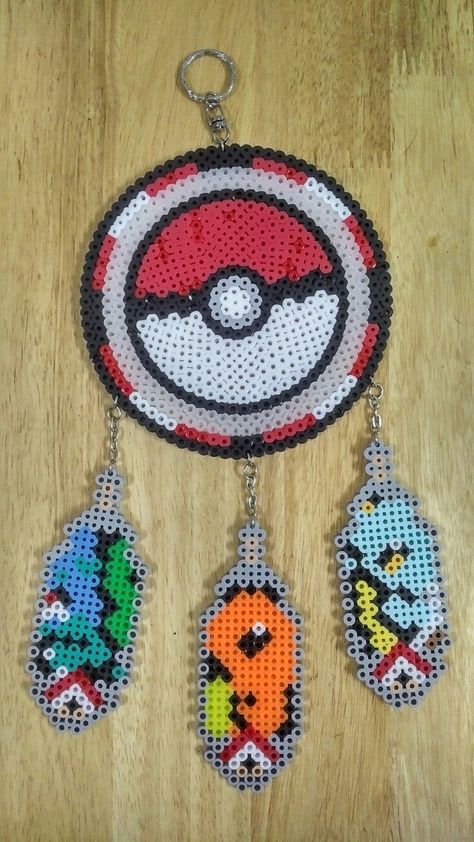 Pokemon Dream Catcher Hamma Beads Dream Catcher, Pokemon Dream Catcher, Melted Bead Crafts, Pony Bead Jewelry, Minecraft Beads, Pony Bead Crafts, Pokemon Perler Beads, Pixel Beads, Perler Bead Templates