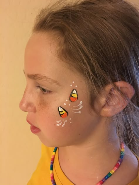 Halloween face painting Candy Corn Face Painting, Face Painting Ideas Aesthetic, Small Halloween Face Paint Ideas, Halloween Face Paint Kids Easy, Simple Fall Face Painting For Kids, Fall Face Painting Ideas Simple, Thanksgiving Face Painting, Halloween Face Painting Ideas For Kids, Candy Corn Face Paint