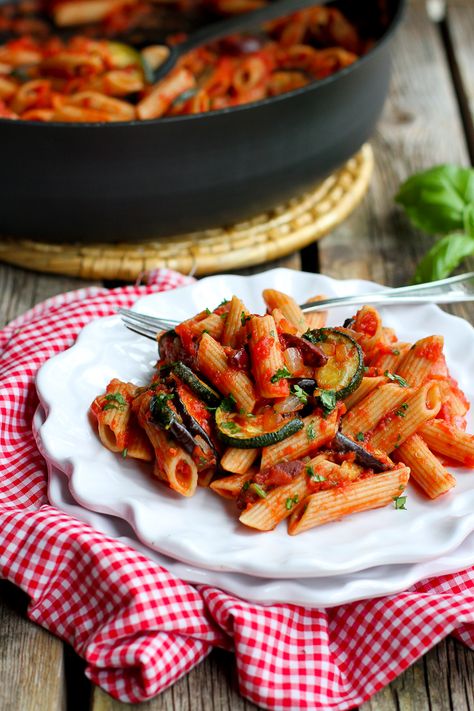 Savory, salt and briny, this wonderful Roasted Vegetable Puttanesca Pasta is easy enough for a casual night and impressive enough for company. Eggplant Pasta Recipes, Eggplant Puttanesca, Puttanesca Pasta, Zucchini And Eggplant, Eggplant Pasta, Zucchini Aubergine, Pasta And Sauce, Roasted Zucchini, Pasta Puttanesca