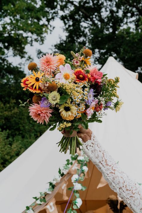 A bright joyful wedding bouquet full of colourful seasonal British grown September flowers. Perfect for a relaxed festival style wedding! Designed and created by @bryonymaeflowers Photography by @LaurenBethPhotography Please click on photo to see more. #festivalwedding #brightweddingbouquet #britishflowers #colourfulwedding #sussexflorist Wildflower Style Wedding Bouquet, Wild Flower Backyard Wedding, Multicolour Wedding Flowers, Fresh Wildflower Bouquet, Wedding Colourful Flowers, Flowers September Wedding, Bright Bridal Flowers, Colourful Fall Wedding, British Summer Wedding