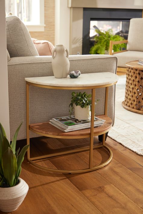 The elegant mixed-material Piper Half Circle Marble Top & Gold Metal Side Table brings two tiers of space-saving storage to any room, hallway, or entry. A chic three-tone accent table for organizing accessories and displaying decor, its versatile half-circular silhouette is perfect for placing flush against a wall or at the end of your sofa. #WorldMarket #EvanstonLiving #MarbleTable #HomeDecor #LivingRoomDecor #EndTable Half Circle Nightstand, Oval End Table, Unique End Tables Living Room, Gold Side Table Living Room, Round End Tables Living Room, Semicircle Table, Circle Accent Table, Couch Side Table, Circular Side Table