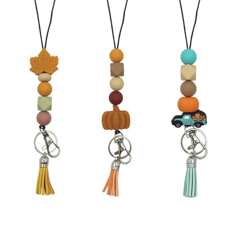 PRICES MAY VARY. Adorable and Unique Designs: Each lanyard features cute silicone beads in fall colors and delightful charms such as pumpkin, maple leaf, and farm truck. These designs are perfect for showcasing your personality and adding a cheerful vibe to your day. Premium Material: These fall teacher lanyards for ID badges are made with washable, durable silicone beads, sturdy cord, leather tassel, strong metal clip, and keyring. These cute breakaway lanyard include breakaway clasp for safety Teacher Lanyards, Lanyard Teacher, Fall Bead, Cute Teacher Gifts, Keychain Ideas, Beaded Lanyard, Teacher Assistant, Teacher Lanyard, School Supply Labels