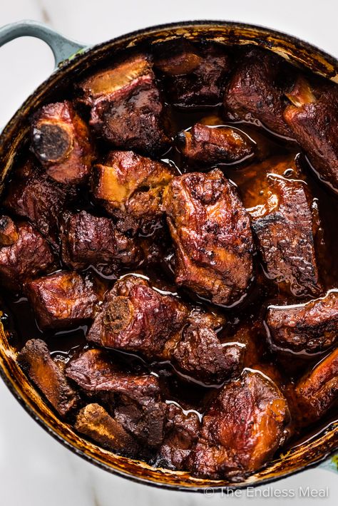 These braised pork ribs are as good as it gets. They're slow-cooked in a ridiculously delicious sauce made with dark beer and chocolate that, by the time the ribs have finished cooking, becomes the best gravy you'll ever try. #theendlessmeal #braisedporkribs #braisedribs #ribs #porkribs #braised #slowcookedribs #dinner #pork Pork Rib Stew Recipe, Tomahawk Pork Chop Recipe, Braised Ribs, Braised Pork Ribs, Dinner Pork, Slow Cooked Ribs, Slow Cooked Pork, Baked Ribs, Juicy Pork Chops