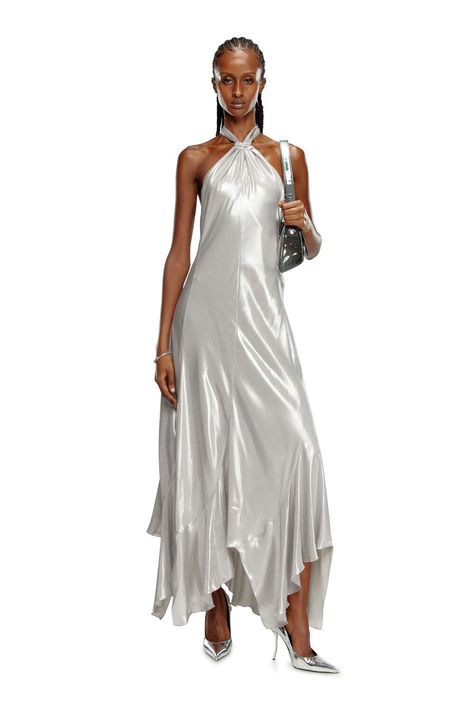 Elevate your style with our Long Metallic Halterneck Dress in Light Grey. This stunning dress features a sleek metallic finish and a flattering halterneck design, perfect for any formal event. The light grey hue adds a touch of sophistication, while the long silhouette ensures a dramatic, elegant look. Shop now to make a memorable impression with this chic and glamorous dress. Grey evening dress. Grey party dress. Grey long dress. Grey maxi dress. Grey Party Dress, Grey Evening Dress, Diesel Dresses, Grey Evening Dresses, Grey Long Dress, Grey Maxi, Laminated Fabric, Grey Maxi Dress, Glamorous Dresses